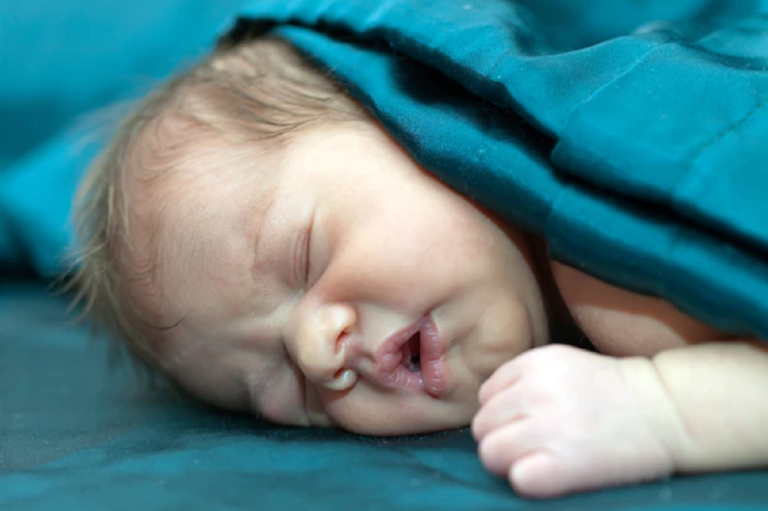 baby sleeps with mouth open